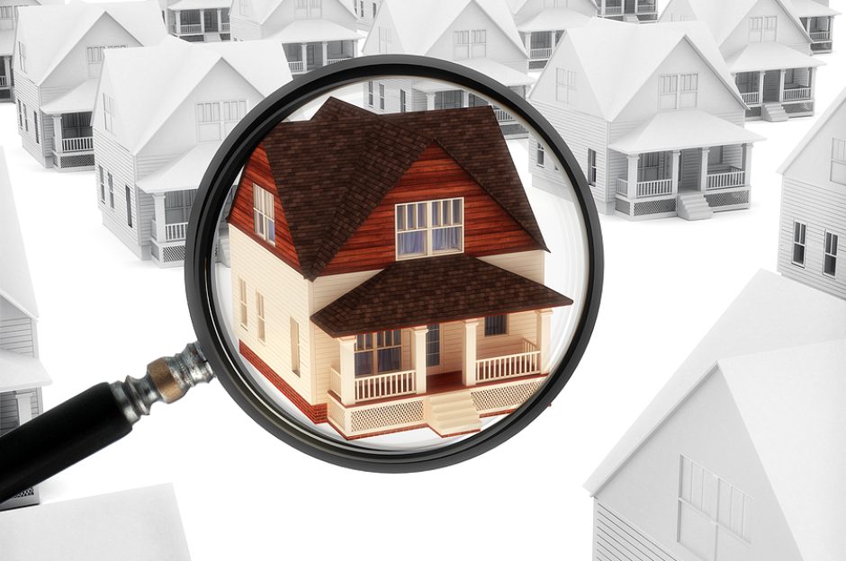 Real estate watch. House with a magnifying glass. Watching the market of real estate, finding a home, or security concept.